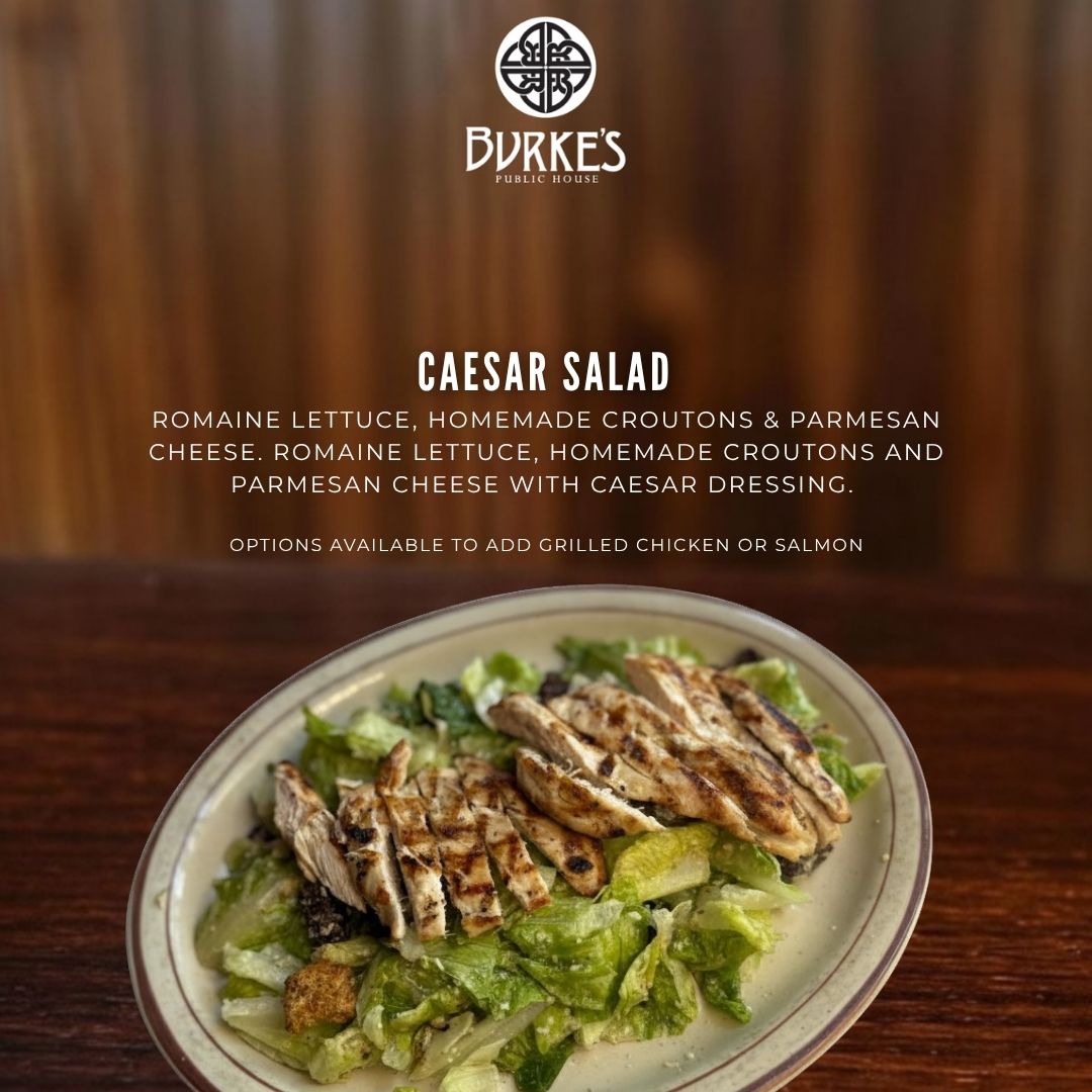 Burke's Caesar Salad with romaine lettuce, homemade croutons, parmesan cheese, and Caesar dressing, with optional grilled chicken or salmon at Burke's Public House in Edgewater, Chicago