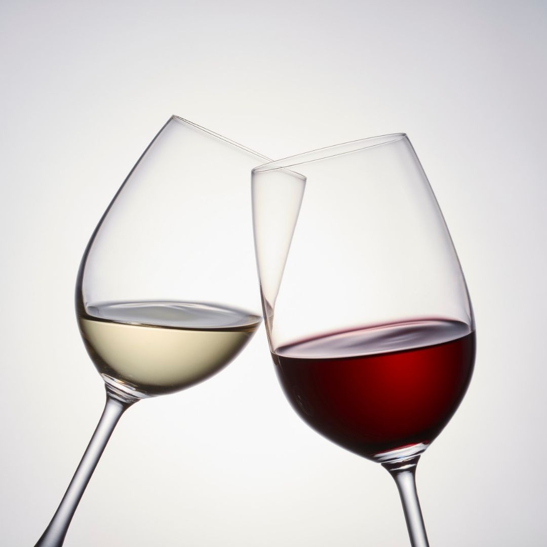 Glasses of red and white wine cheersing at Burke's Public House